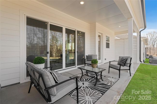 Covered Back Patio with "accented" green sod | Image 40