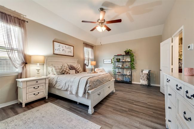 Bedroom featuring dark wood finished floors and ceiling fan | Image 27