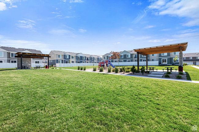 View of community featuring a residential view and a playground | Image 31