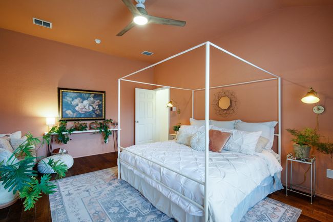 Bedroom with wood-type flooring, lofted ceiling, and ceiling fan | Image 13