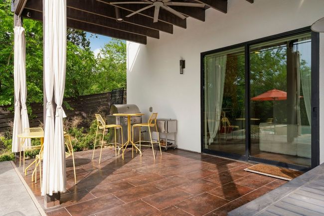 The covered patio if perfect for grilling by the pool. | Image 36