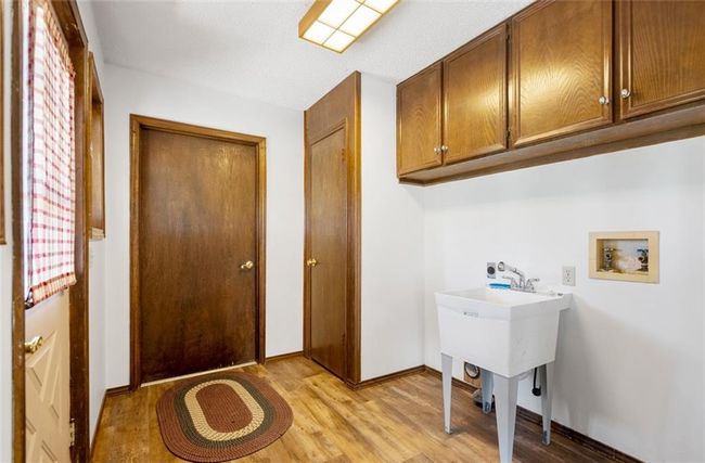 space, baseboards, washer hookup, and light wood-type flooring | Image 20