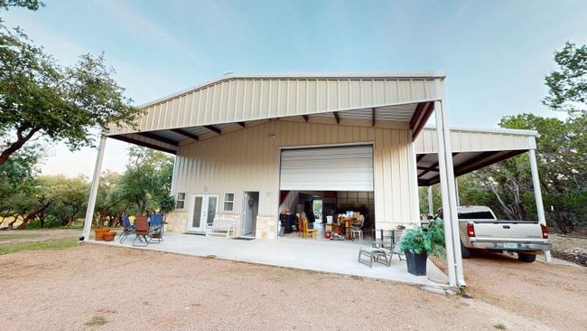 Indoor and outdoor covered RV parking / workshop. Building has large overhead doors on both ends for drive-through. | Image 34