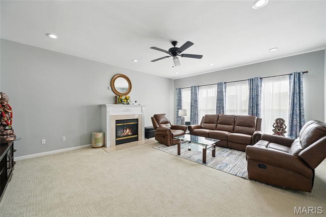Living room featuring a tile fireplace, recessed lighting, carpet flooring, and ceiling fan | Image 8