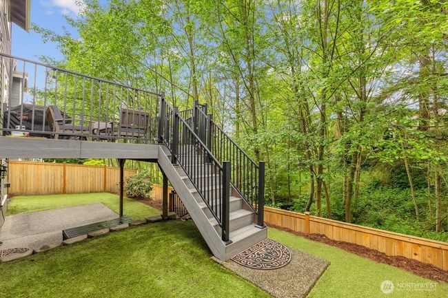 Stairs from main to , lower level. Turf installed for easy maintenance | Image 27
