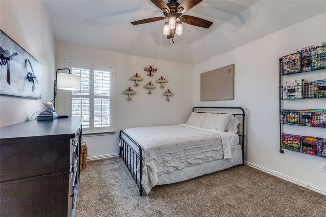 Bedroom number 3 with ceiling fan and large closet. | Image 19