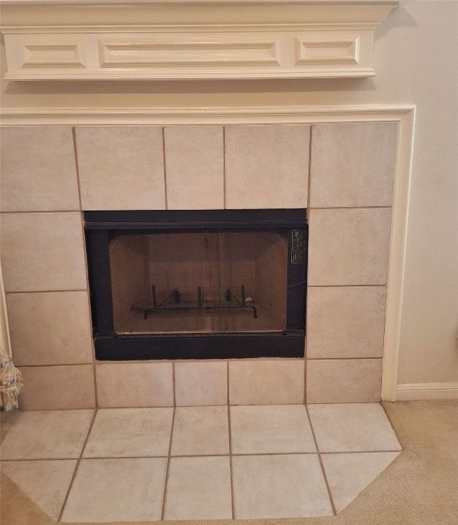 Interior details with a tiled fireplace and carpet | Image 9