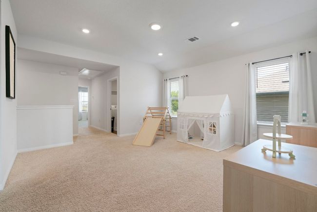 Rec room with recessed lighting, carpet, vaulted ceiling, and attic access | Image 19