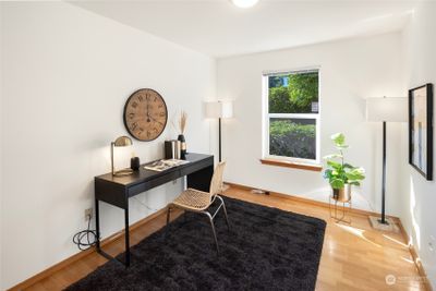 A flexible space with plenty of light, ideal for a home office, study or additional bedroom, this first/lower level room features new paint and hardwood floors for a stylish environment. | Image 3