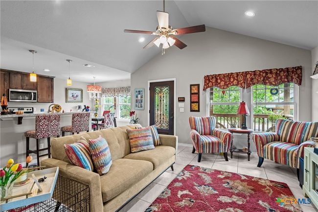 Living room that opens to kitchen | Image 8