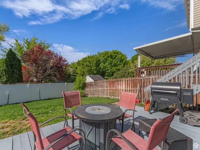 Wooden deck with outdoor dining space | Image 36