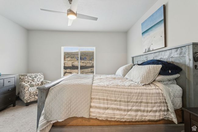 Carpeted bedroom featuring ceiling fan | Image 22