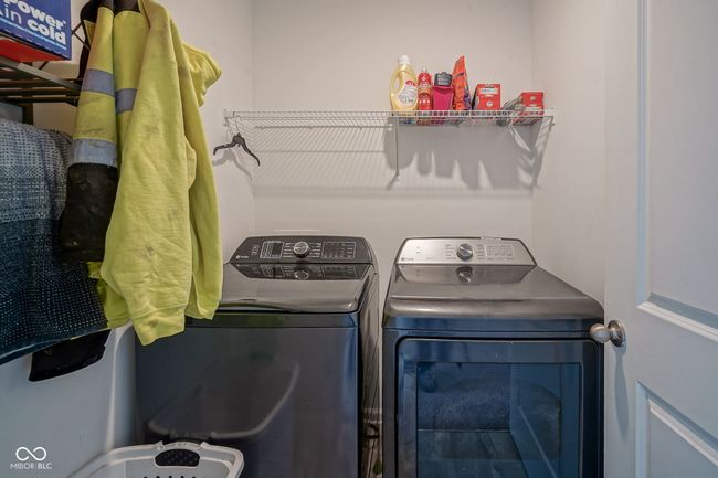 laundry area with washing machine and dryer | Image 29