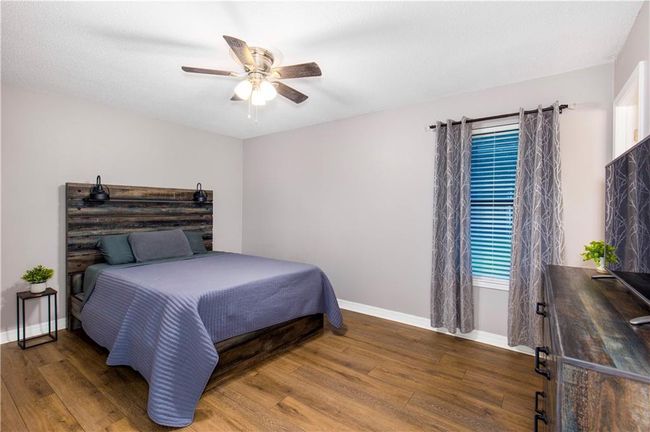 Bedroom with ceiling fan and ensuite bathroom | Image 14