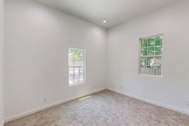 Spare room with a wealth of natural light and carpet flooring | Image 21