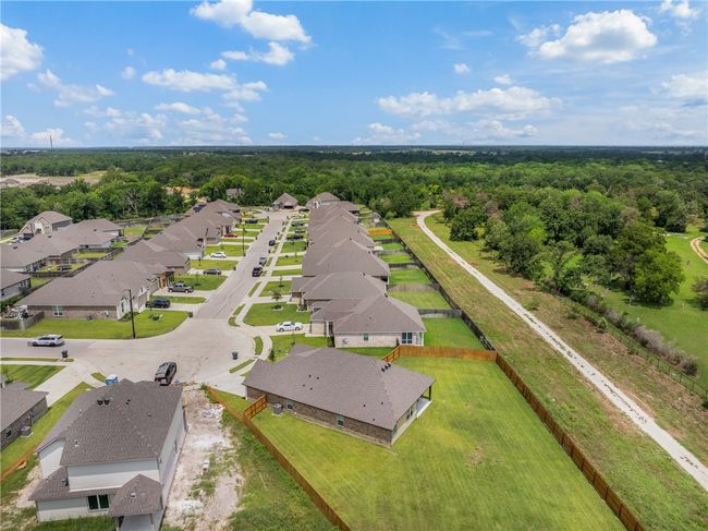 Aerial view of residential area with a forest | Image 35