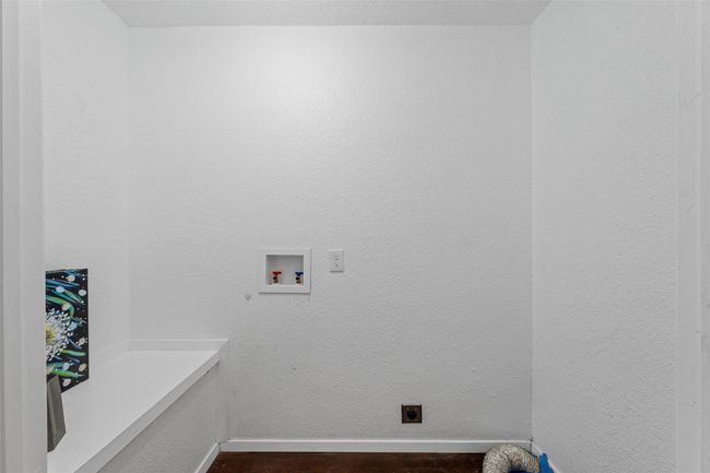 Laundry room featuring hookup for an electric dryer, washer hookup, dark wood-style floors, and baseboards | Image 28