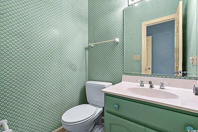 Bathroom featuring vanity, toilet, and wallpapered walls | Image 19