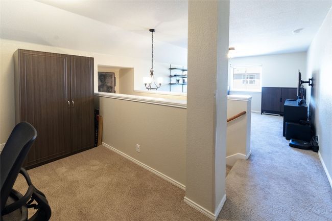 Upper loft area is separated for a work/study space and game room | Image 22