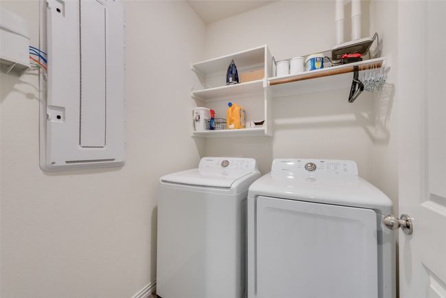 Washroom featuring washer and clothes dryer | Image 15