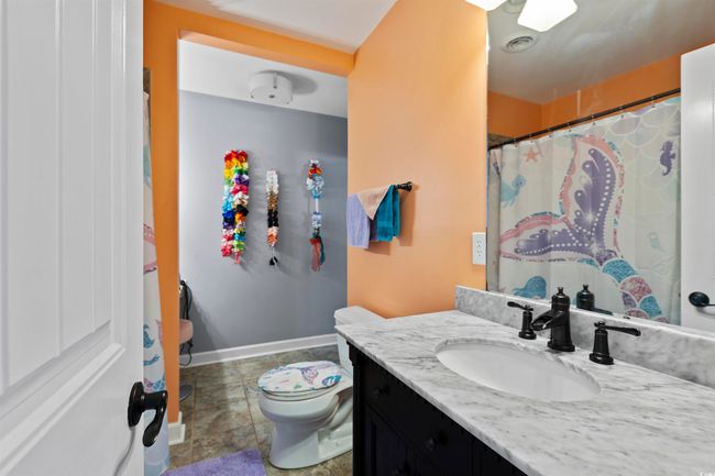 Full bath with toilet, vanity, baseboards, and a shower with shower curtain | Image 19