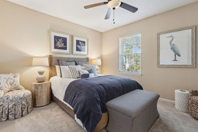 Generously sized upper-level guest bedroom with ample closet space. | Image 20