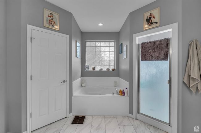 Bathroom featuring a bath, marble finish floor, and recessed lighting | Image 20