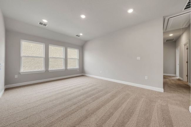 Unfurnished room featuring attic access, light colored carpet, and recessed lighting | Image 15