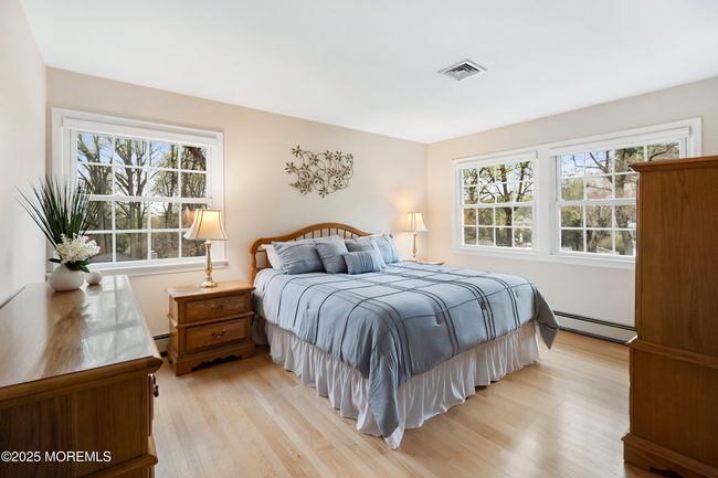 King sized bed in the primary suite | Image 24