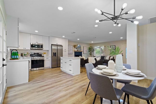 Dining area with visible vents, a chandelier, recessed lighting, and light wood finished floors | Image 20