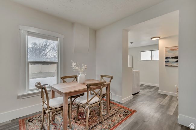 Dining room featuring baseboards and wood finished floors | Image 4