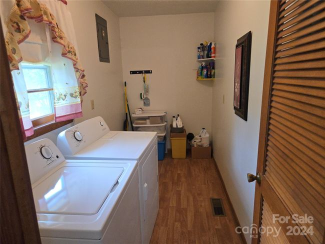 Nice sized and convenient laundry room | Image 9