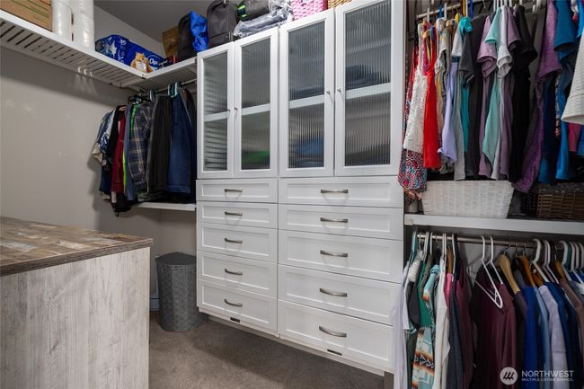 The primary walk in closet has builtins. | Image 27