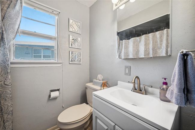 Bathroom with tub and shower combo. | Image 17