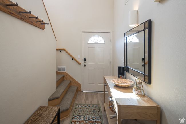 Entryway with light wood-type flooring | Image 10
