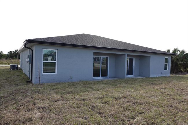 12223 Kirk Ave, Home with 6 bedrooms, 4 bathrooms and null parking in Port Charlotte FL | Image 7