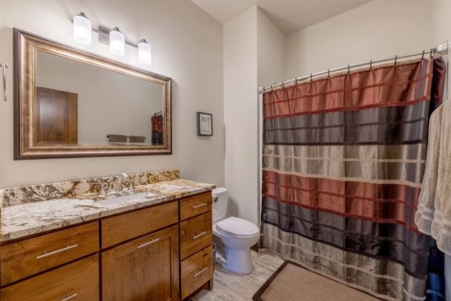 Full bath featuring toilet, vanity, and a shower with shower curtain | Image 39