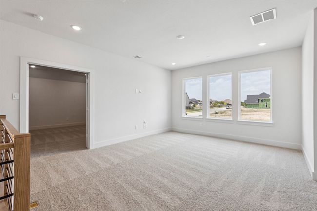 Take the party upstairs to this light filled game room with adjacent media room! | Image 15