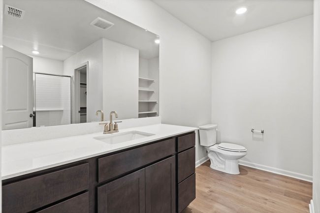 Bathroom with light wood-style floors, vanity, and recessed lighting | Image 7