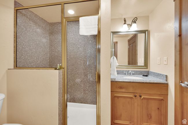 Full bath with toilet, a stall shower, and vanity | Image 24