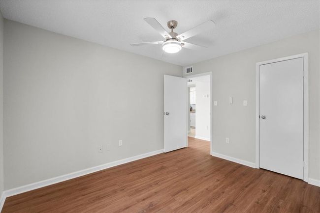 Big enough for guests, cozy enough for daydreams—this 2nd bedroom has all the good vibes | Image 22