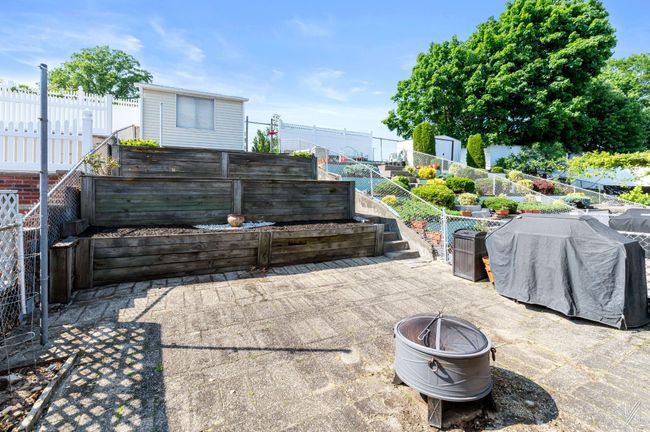 Fenced backyard featuring a patio area and an outdoor fire pit | Image 17