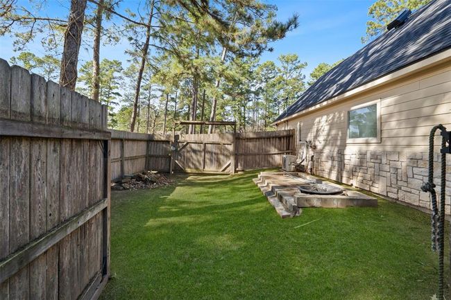 This portion of the side yard has a large gate access. This area can be used to store a boat, camper, lawn equipment, etc. | Image 36