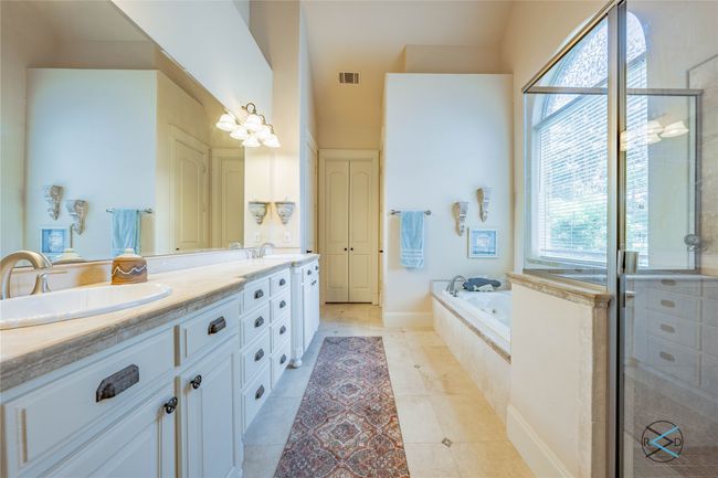 Bathroom with independent shower and bath, dual vanity, and tile floors | Image 14