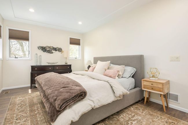 Primary bedroom has recessed lighting and updated flooring, and 9-foot ceilings | Image 25