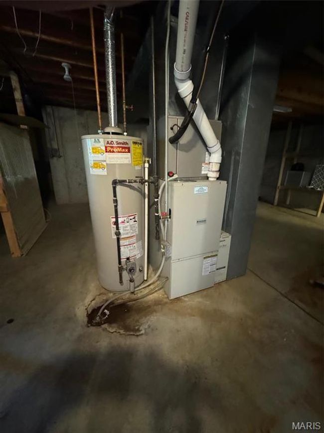 Utility room with gas water heater and furnace | Image 42
