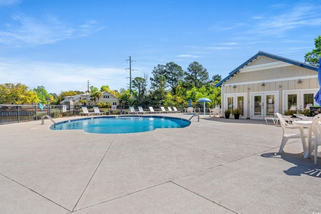 Community pool featuring french doors, a patio area, and fence | Image 34