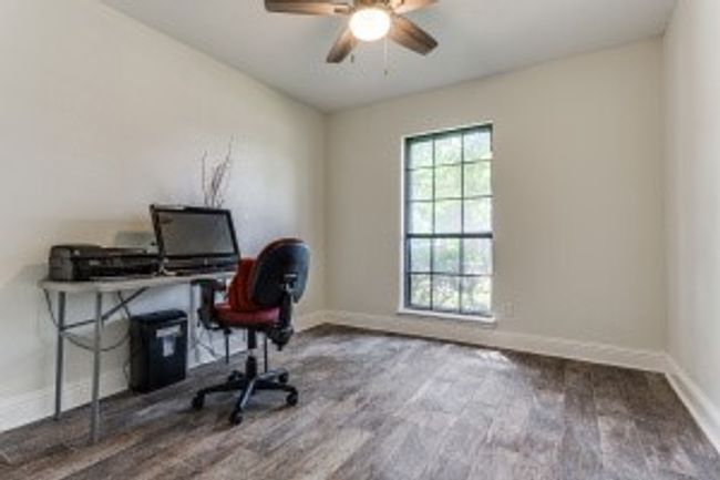 Office space featuring ceiling fan, baseboards, and wood finished floors | Image 4
