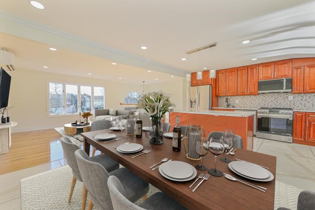 Dining area with ornamental molding and a wall mounted AC | Image 26