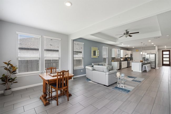 sunroom-style bonus area off of The oversized windows in this room create a bright and inviting space. | Image 18
